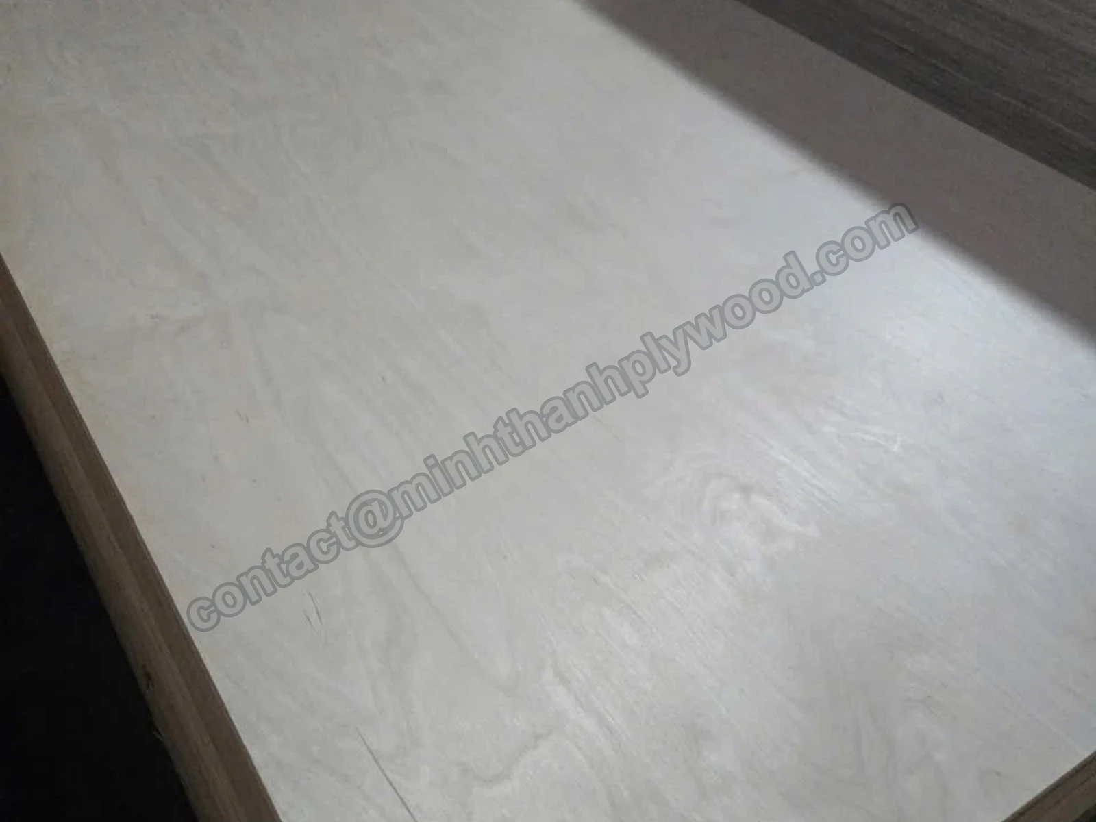 Birch plywood surface with pale natural swirl figure