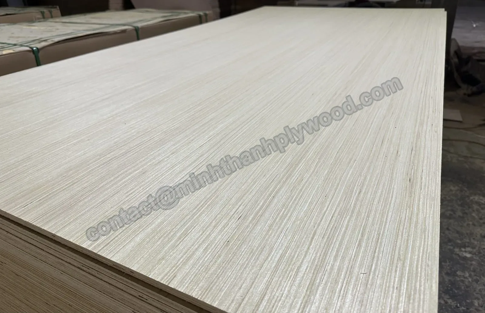 Straight-grain engineered veneer faced panel on a stack