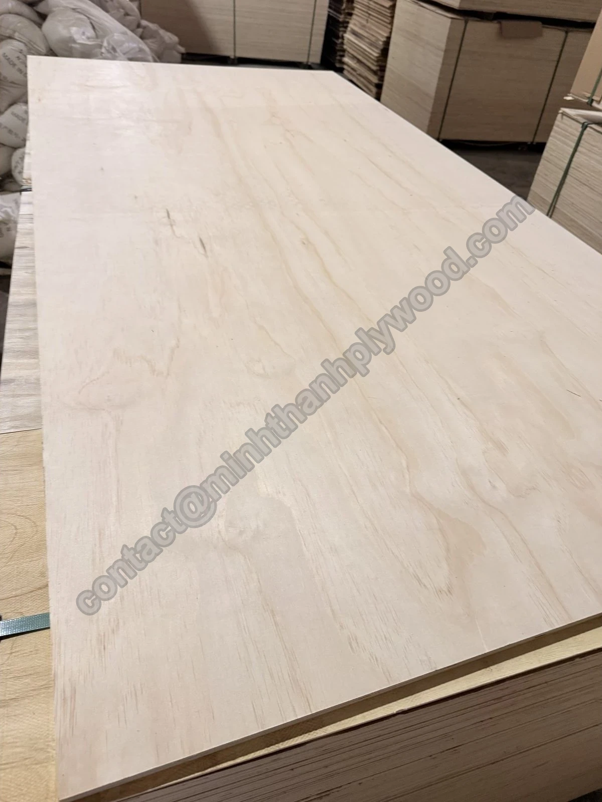 Veneer grading result: whole pine-faced plywood panel on a finished pack