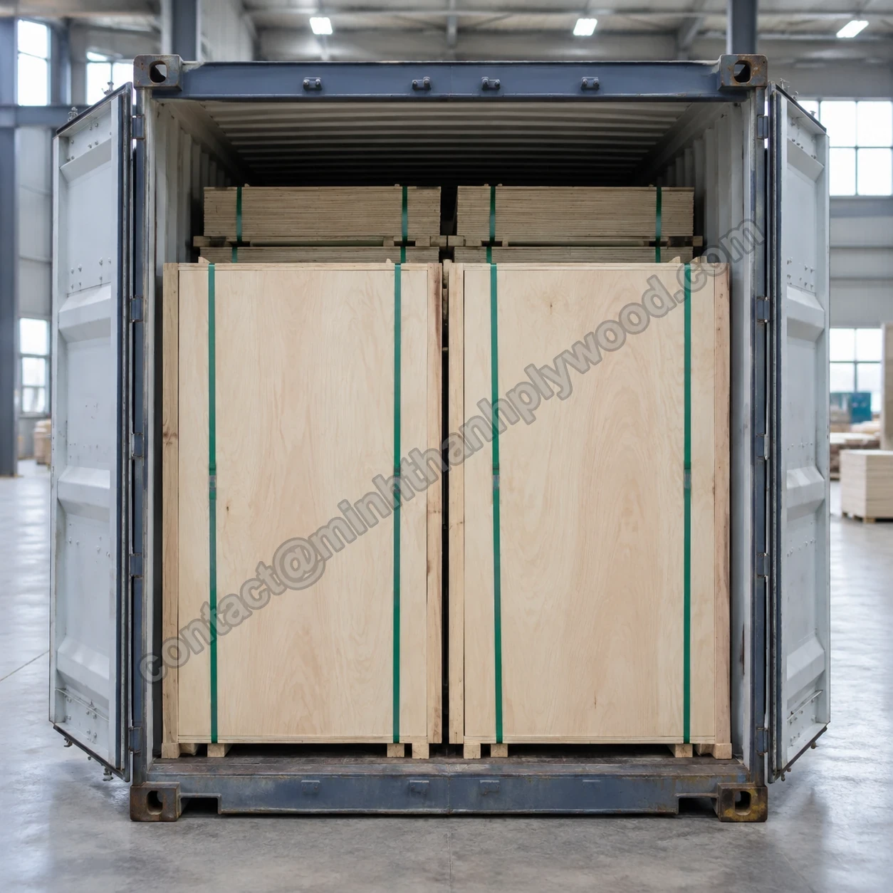 Two plywood packs standing upright side by side at the door end of a loaded container